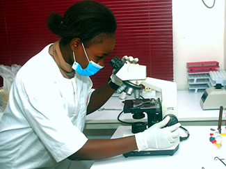 A technician working in the CHI Farms laboratory