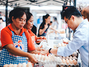 Visitors purchase eggs from local poultry farmers