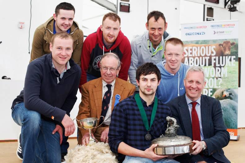 Raymond Irvine (R) presents Jack Robinson with his trophy